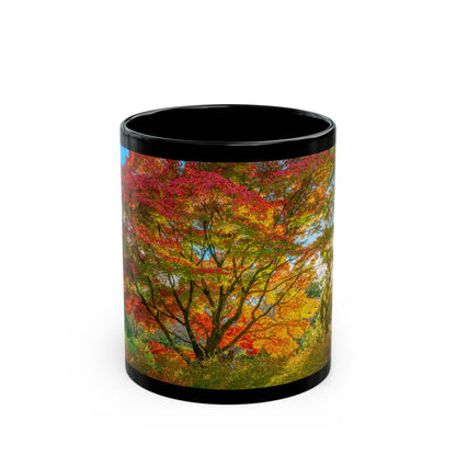 Black coffee mug with vivid red Kyoto maple autumn foliage, Japan